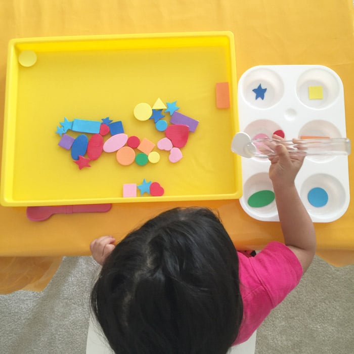 Teaching toddler shapes through water play