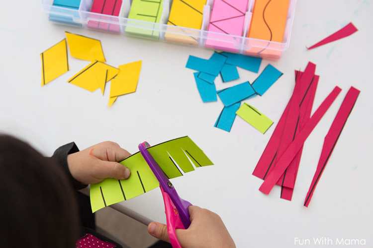 toddler cutting paper