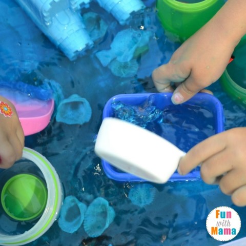 Under the sea sensory bin scooping water (Small)