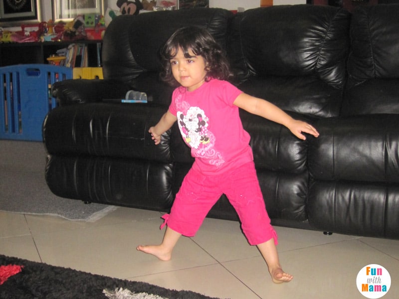 child doing yoga at home 