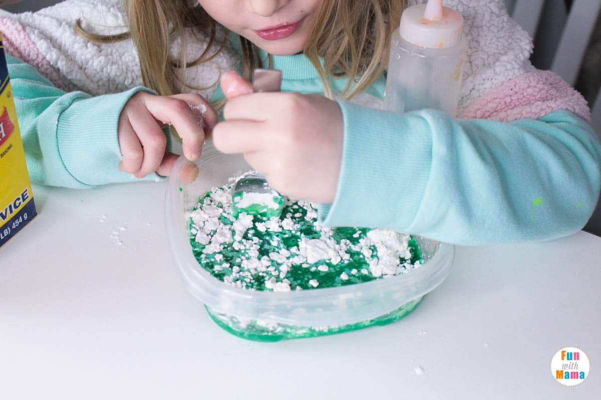 stirring together the ingredients in this oobleck recipe 