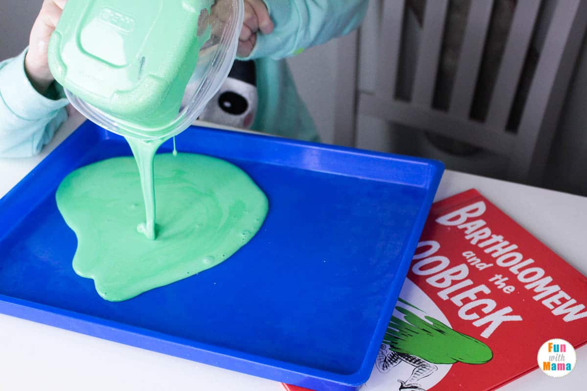pouring the oobleck out onto a flat surface 