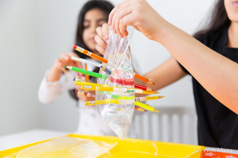 Water In A Bag Pencil Experiment for kids to have cool science fun! 