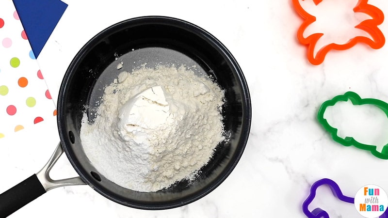 adding flour to stove and pan