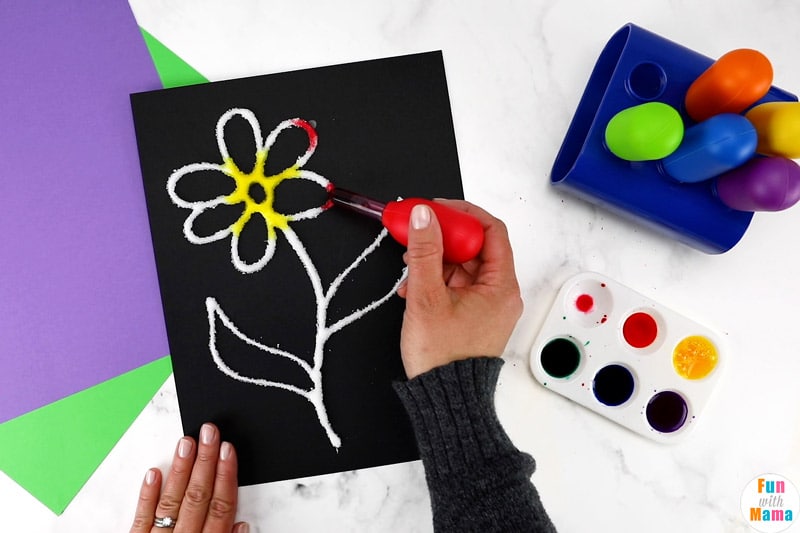 adding paint to the glue flower 