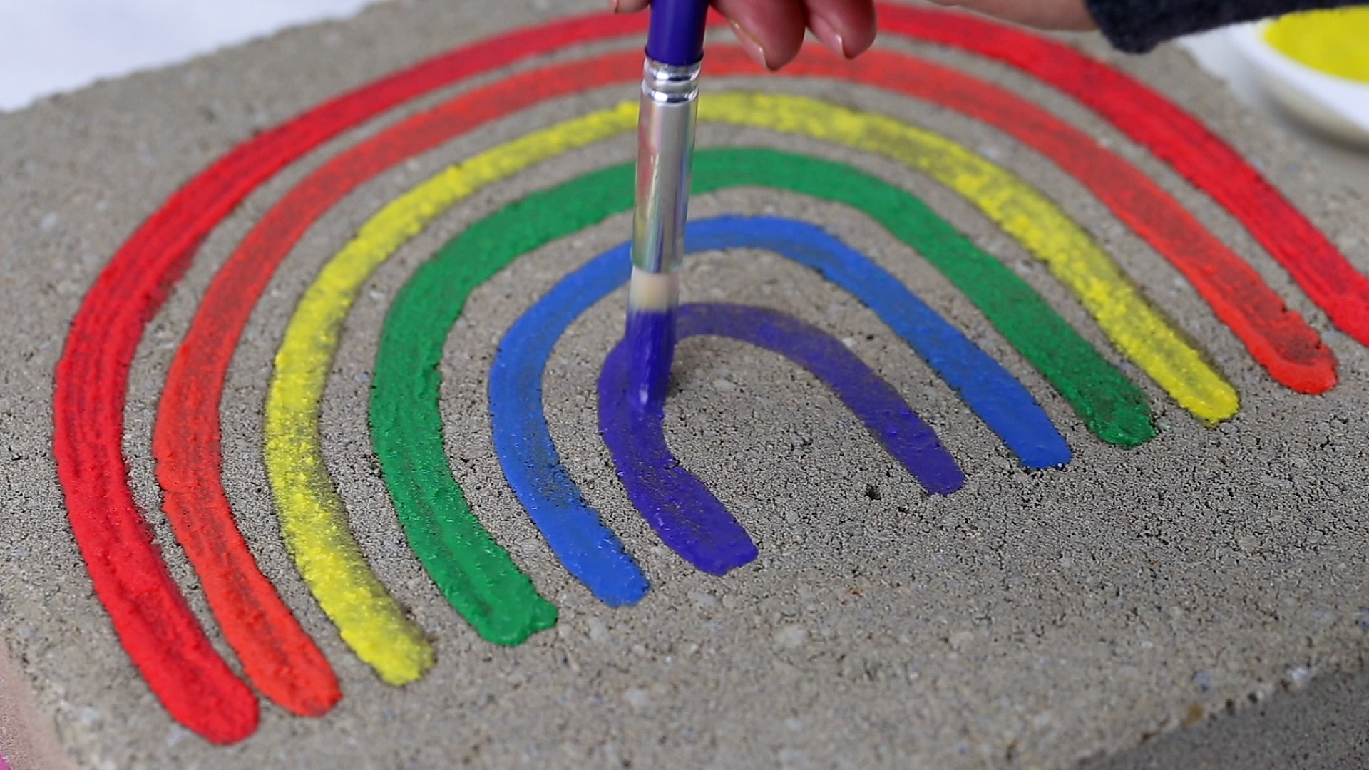 painting on the sidewalk with chalk paint