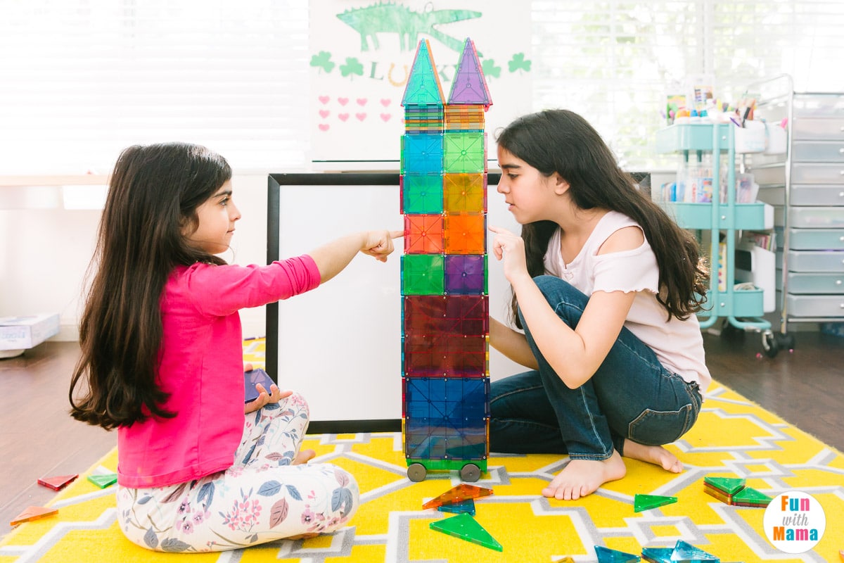 two girls playing with magnetic kits 