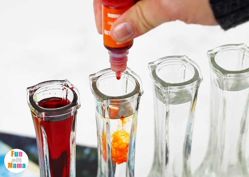 adding orange drops into the water