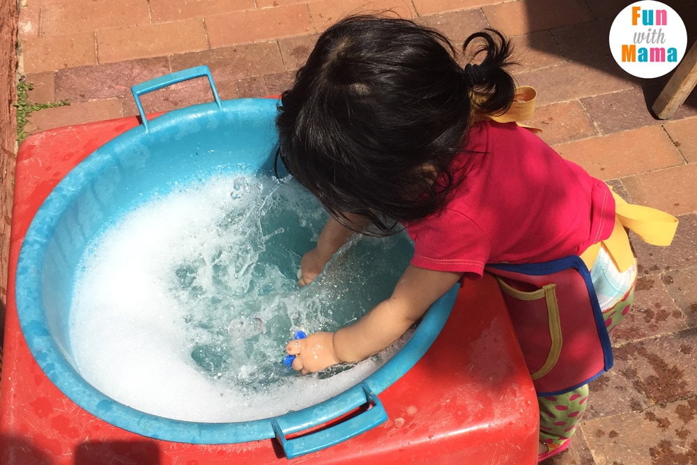 one year old playing with water