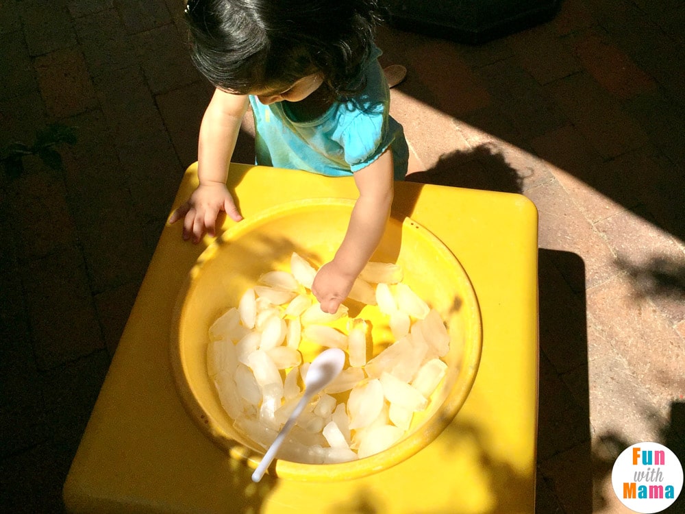 one year old playing with ice