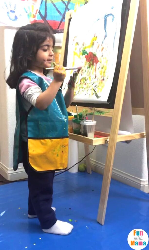 toddler painting a picture