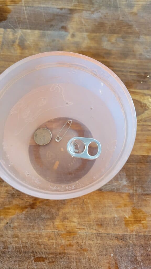 seeing if all the objects dropped to the bottom of the cup 