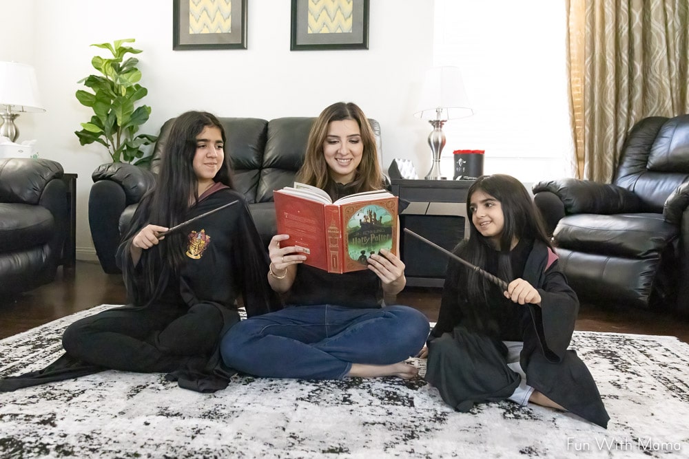 mom and kids reading a book 