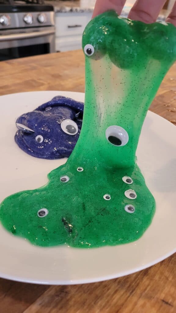 stretchy green monster slime with googley eyes 