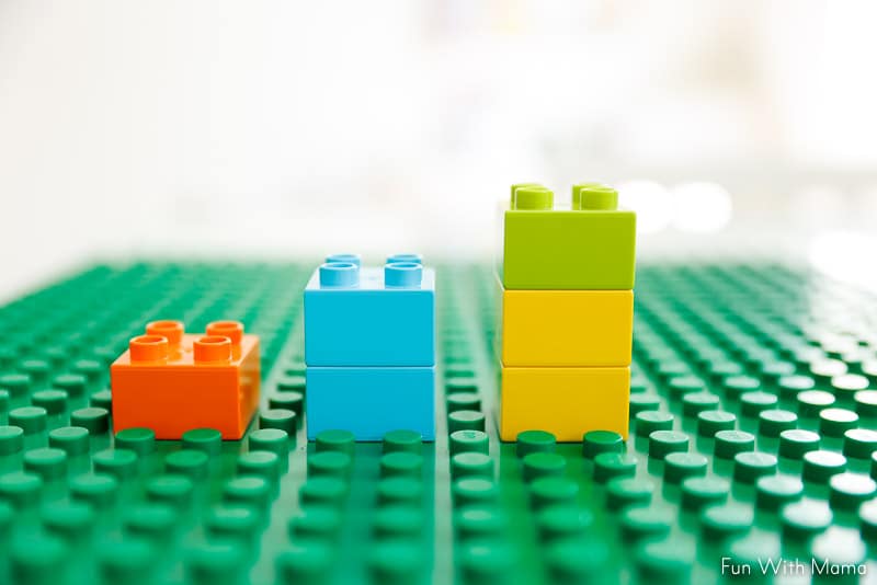 stacking legos to work on number skills 
