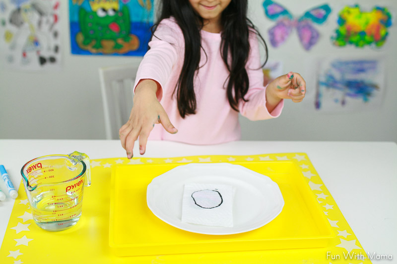 Child, doing magic, paper towel craft