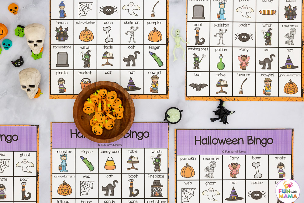 halloween bingo cards and a bowl of pumpkin erasers 
