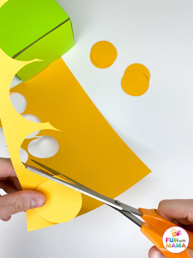 cut gold coin circles from yellow paper