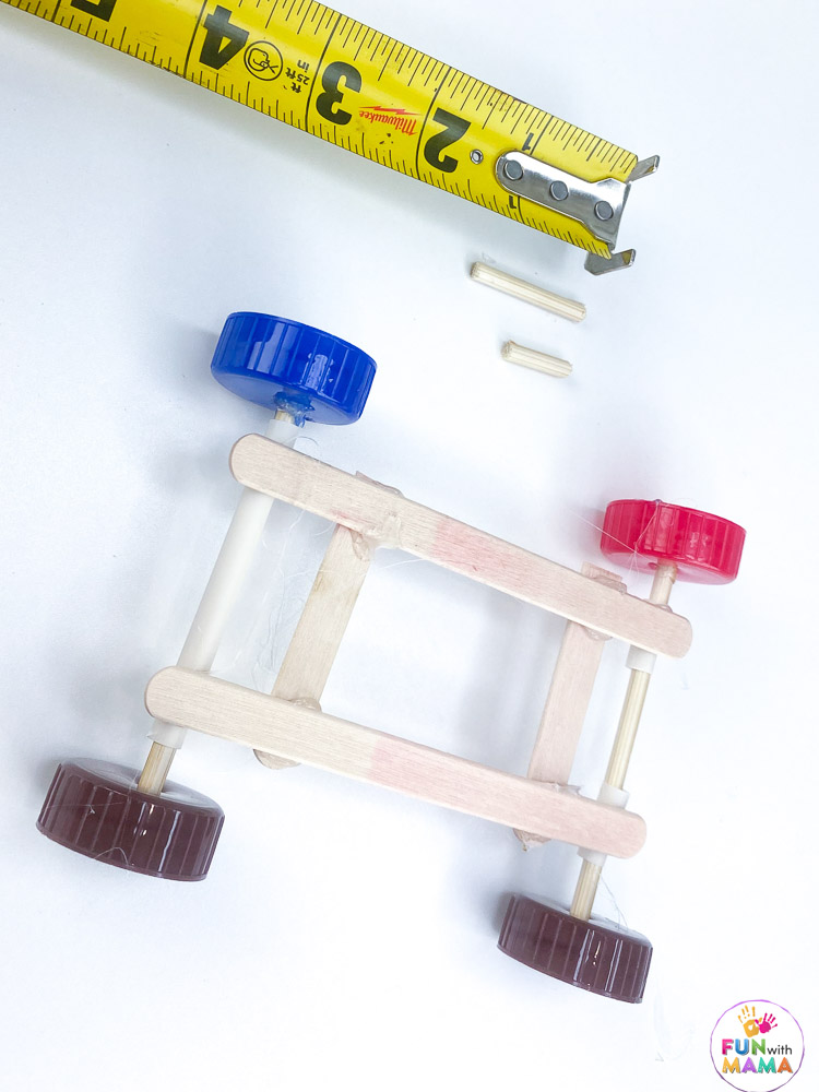 rubber band car with with craft sticks and bottle caps