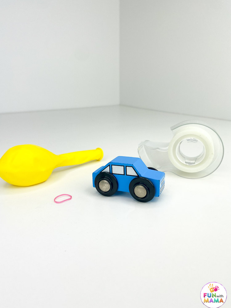 balloon tape and wooden car