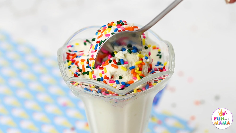 adding sprinkles to the ice cream